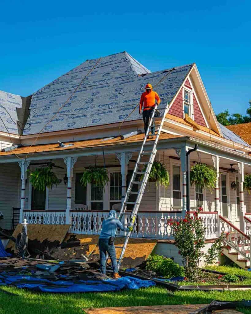 Roofing contractors changing a roof