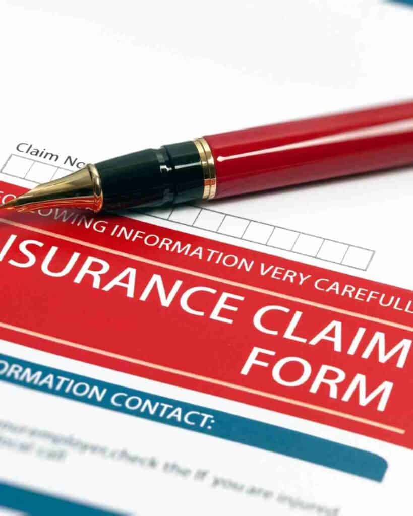 Insurance claim form with a red pen for commercial truck insurance in Texas.
